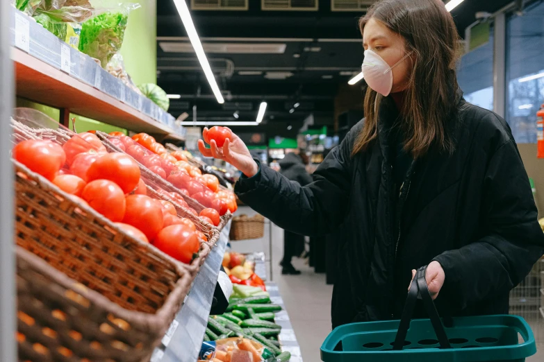 a woman wearing a face mask shopping in a grocery store, by Julia Pishtar, pexels, tomato hat and a walking stick, sydney hanson, 🦩🪐🐞👩🏻🦳, cover story