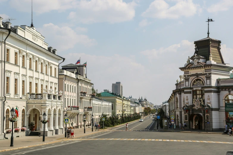 a city street lined with tall buildings and a clock tower, inspired by Illarion Pryanishnikov, pexels contest winner, socialist realism, khreschatyk, 000 — википедия, square, panoramic shot