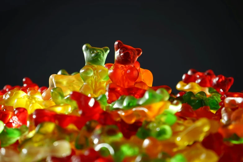 a pile of gummy bears sitting on top of each other, by Adam Marczyński, pexels, visual art, macro photography 8k, lesbians, 🐿🍸🍋, male and female