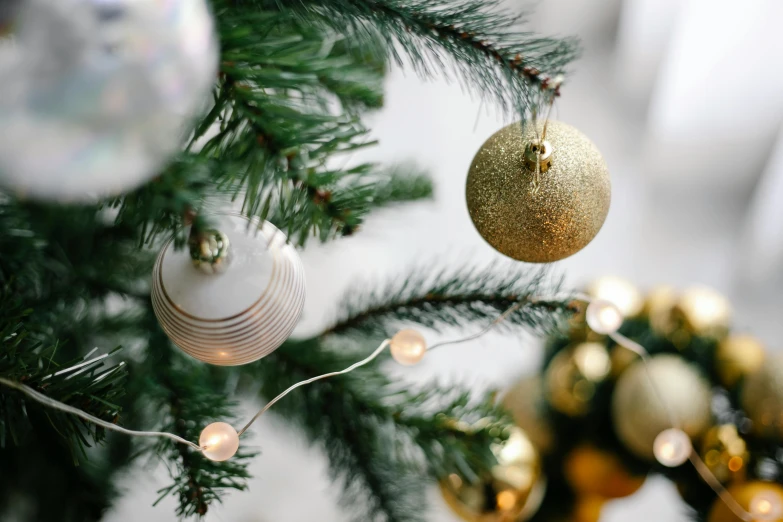 a close up of a christmas tree with ornaments, pexels, gold and white, blank, grey, maritime pine