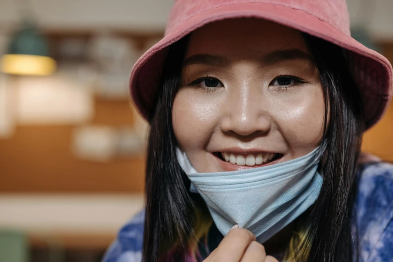 a close up of a person wearing a face mask, trending on pexels, mingei, smiling girl, hong june hyung, avatar image, colored photo