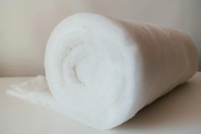 a roll of white fabric sitting on top of a table, made of cotton candy, detailed product image, detail shot, white foam