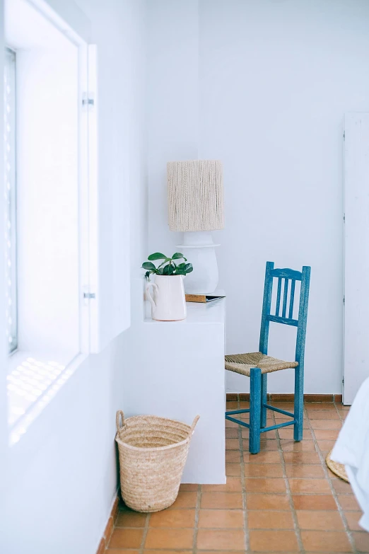 a bed room with a bed a chair and a window, inspired by Riad Beyrouti, unsplash, light and space, bright blue, basic white background, small details, studying in a brightly lit room