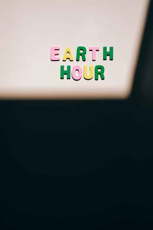 a laptop computer sitting on top of a desk, an album cover, by Carey Morris, unsplash, midnight hour, earth and pastel colors, green letters, ecology