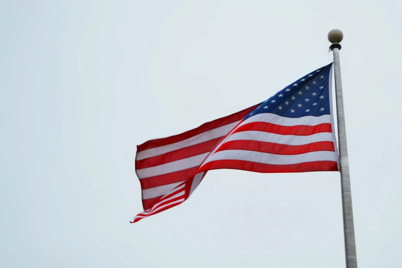 an american flag flying high in the sky, pexels, on a gray background, slide show, instagram picture, ap news