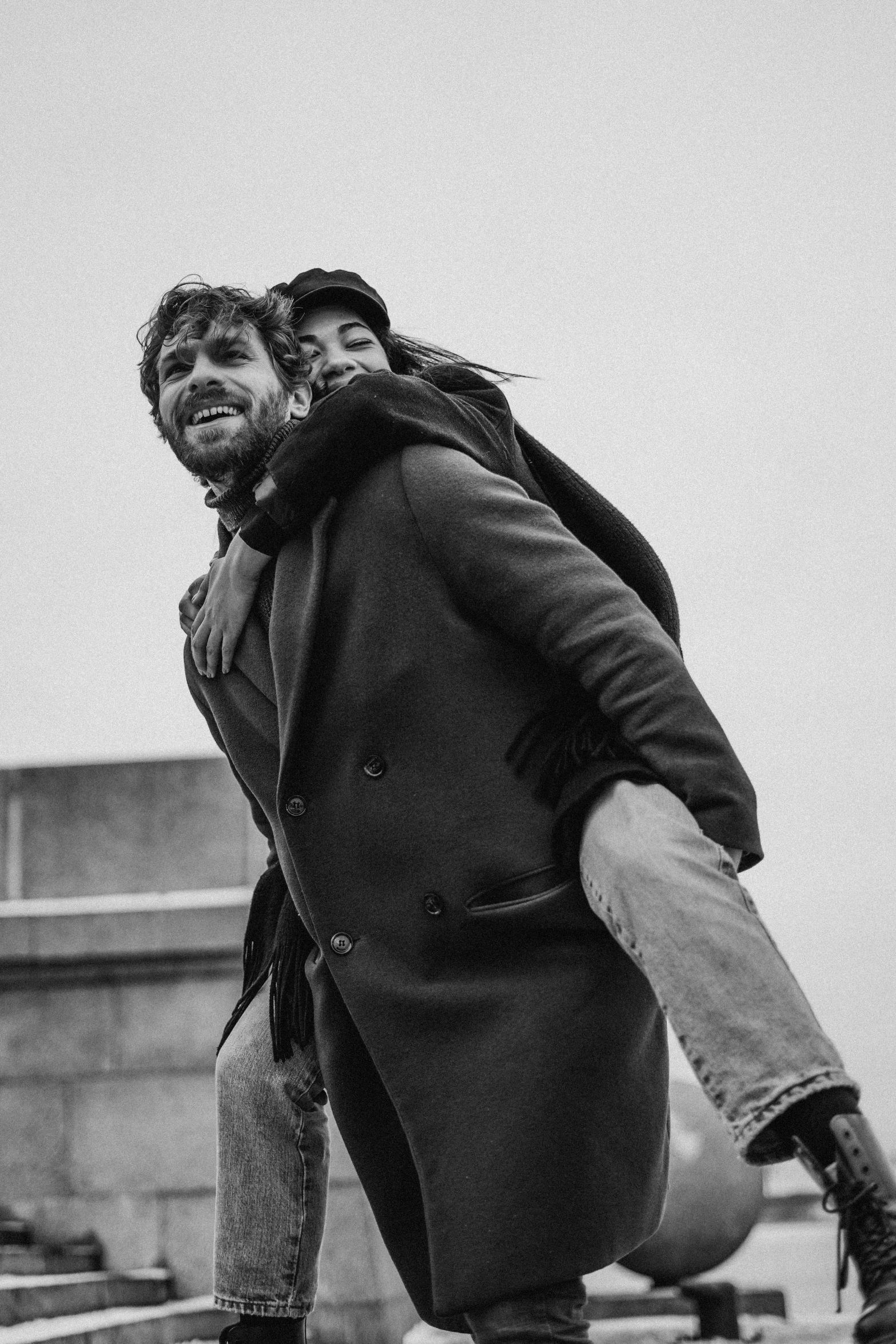 a black and white photo of a man riding a skateboard, a black and white photo, pexels contest winner, renaissance, happy couple, amelie poulain, attractive man, jesus hugging a woman