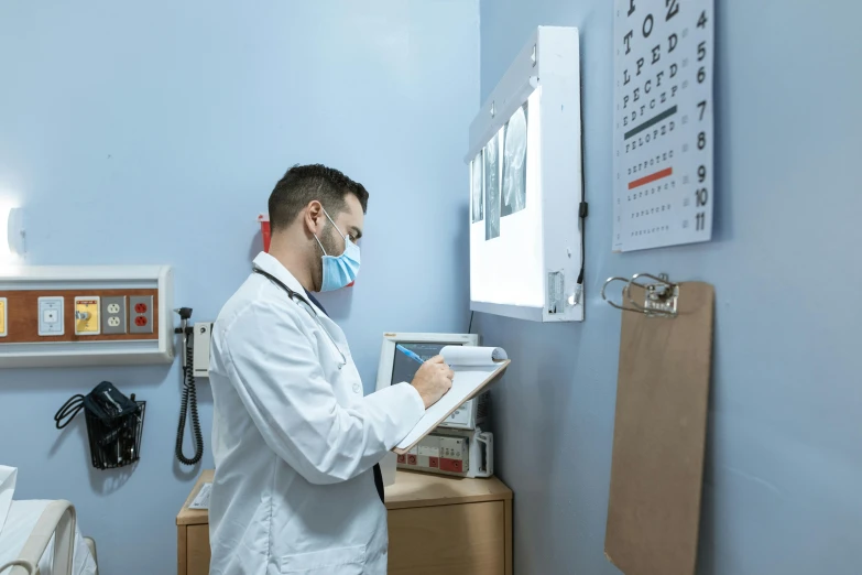 a man in a white lab coat holding a clipboard, a picture, by Adam Marczyński, pexels contest winner, doctors office, right side profile, masked person in corner, 15081959 21121991 01012000 4k