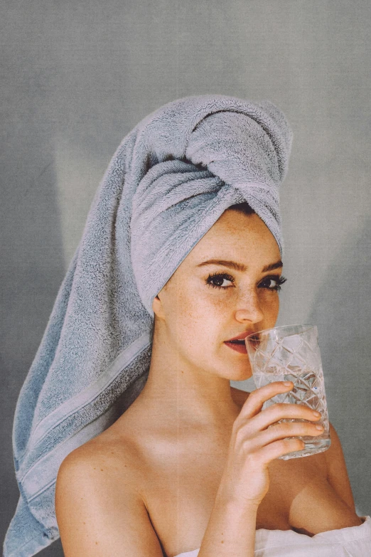 a woman with a towel wrapped around her head drinking water, by Carey Morris, trending on pexels, renaissance, portrait sophie mudd, on clear background, made of water, uncropped