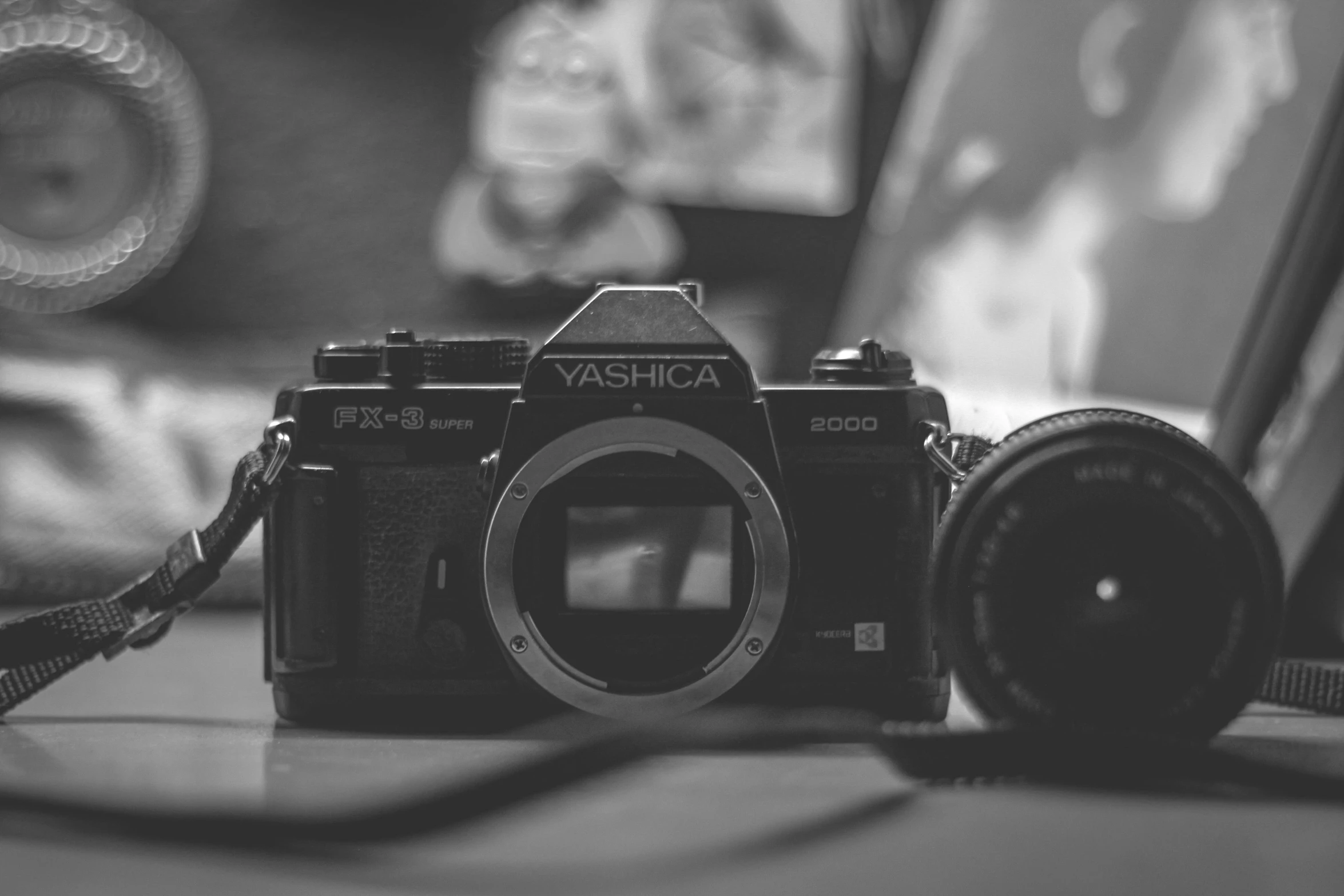 a black and white photo of a camera, a black and white photo, by Adam Marczyński, unsplash, 80s photo, [ realistic photography ], today\'s featured photograph 4k, cute photograph