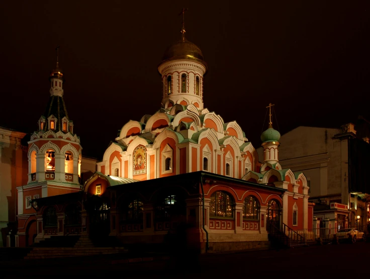 a picture of a church lit up at night, an album cover, by Andrei Kolkoutine, pexels contest winner, in moscow centre, square, reddish, 000 — википедия