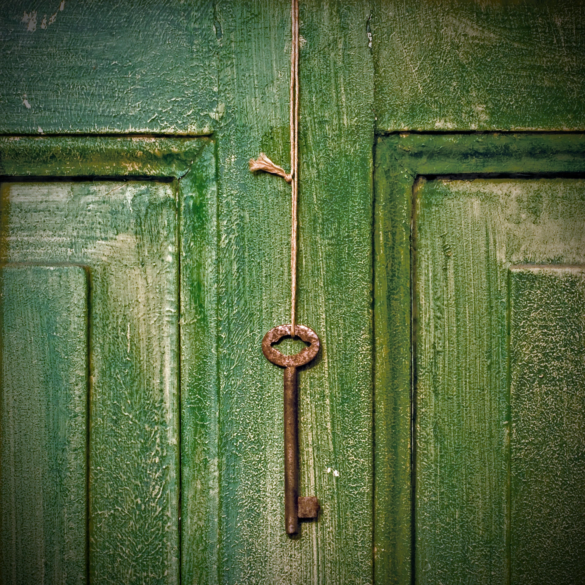 an old key hanging on a green door, an album cover, by Elsa Bleda, unsplash, symbolism, copper patina, square, freemason symbol, in 2 0 1 2