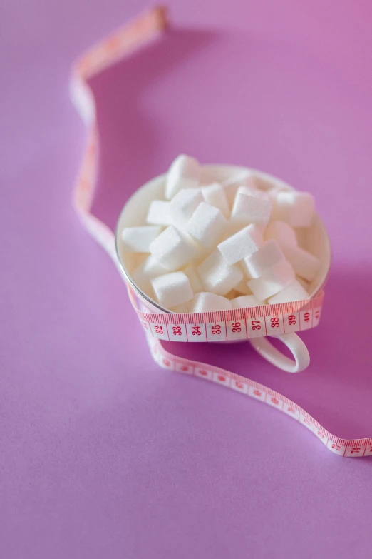 a measuring tape wrapped around a bowl of sugar cubes, by Elaine Hamilton, trending on pexels, figuration libre, soft light 4 k in pink, square, 15081959 21121991 01012000 4k, small