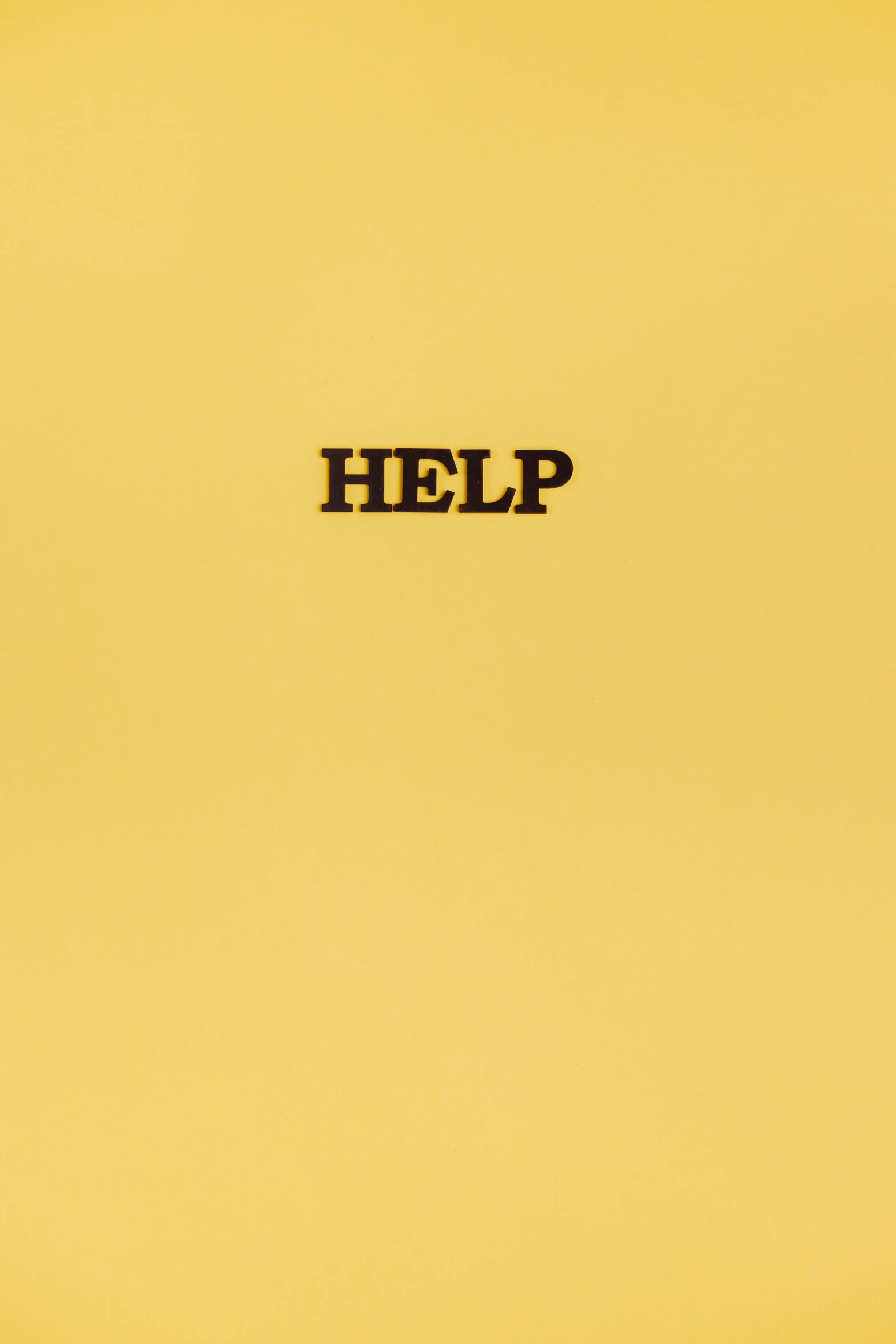 a yellow book with the word help written on it, an album cover, tumblr, ffffound, david klein, sap, high quality photo