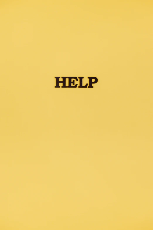 a yellow book with the word help written on it, an album cover, tumblr, ffffound, david klein, sap, high quality photo
