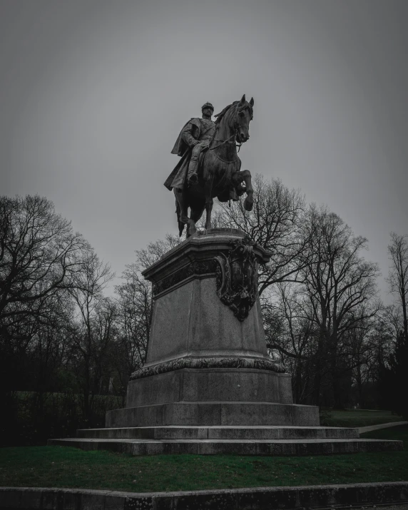 a black and white photo of a statue of a man on a horse, a statue, pexels contest winner, a park, on a dark winter's day, the president, king of the hill