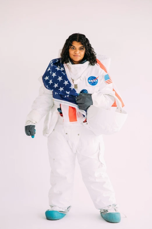 a woman in an astronaut suit posing for a picture, jayison devadas, on the white background, holding a white flag, lookbook