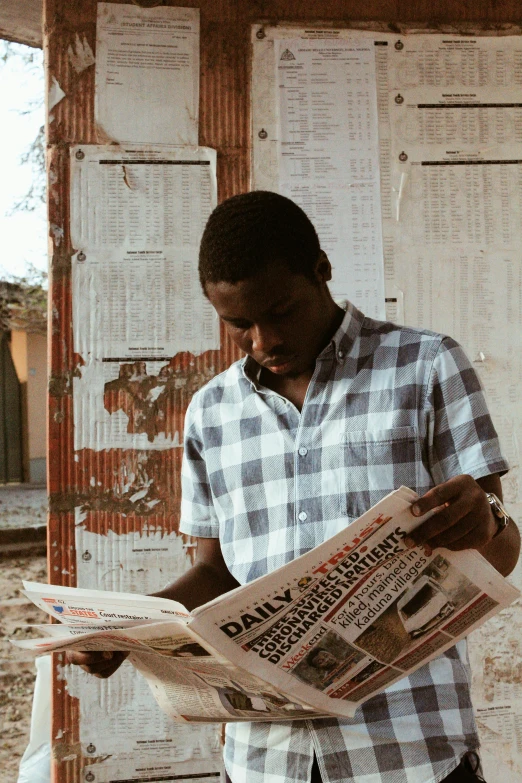 a man reading a newspaper in front of a building, an album cover, trending on unsplash, happening, african, film still promotional image, studio photo, bahamas