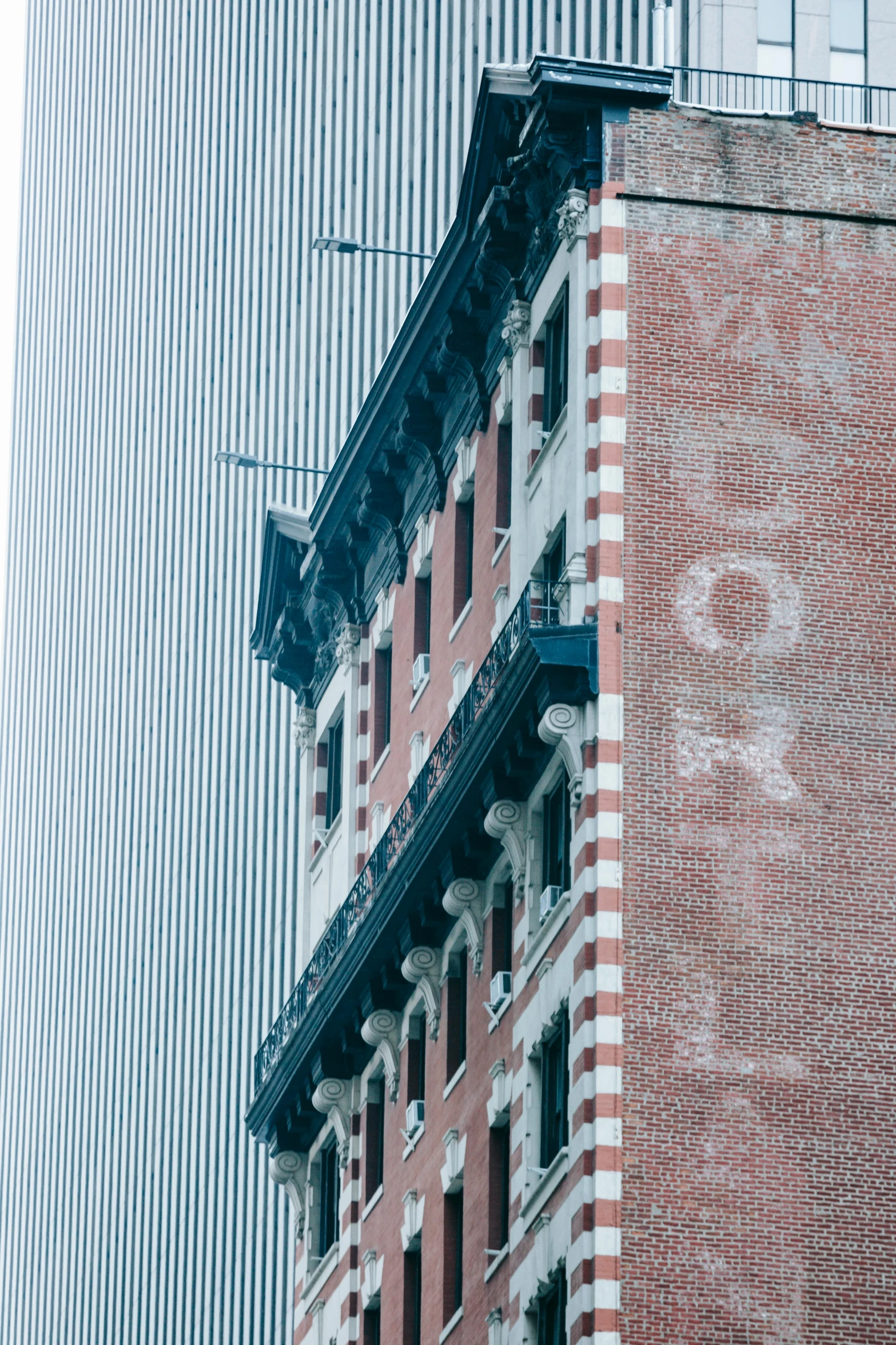a clock that is on the side of a building, inspired by Paul Cornoyer, graffiti, 2019 trending photo, new york buildings, sparse detail, 1999 photograph