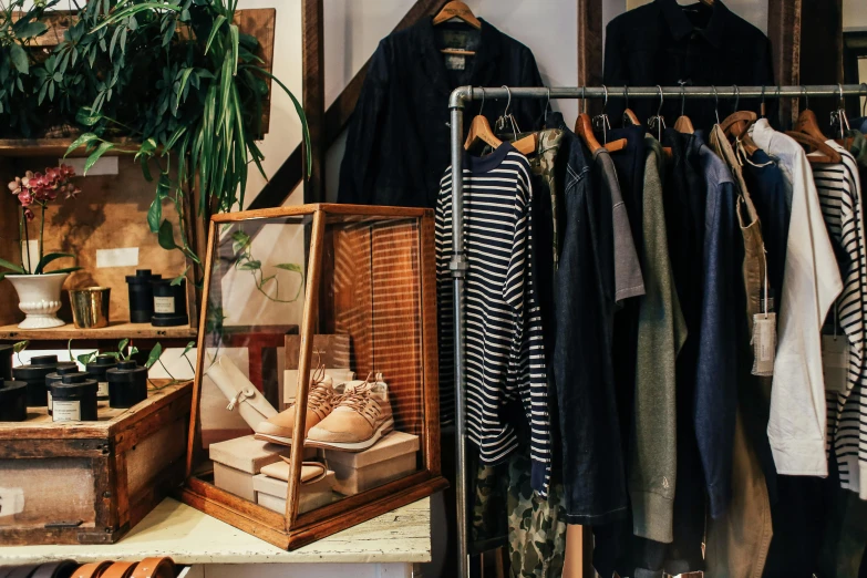 a bunch of clothes hanging on a rack in a room, a photo, trending on unsplash, renaissance, sitting on a store shelf, rugged details, federation clothing, presenting wares