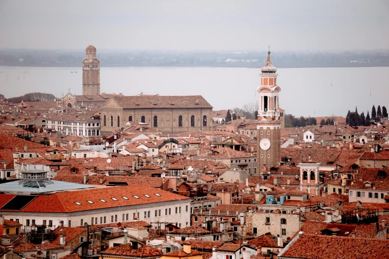 a view of a city with a clock tower, inspired by Quirizio di Giovanni da Murano, pexels contest winner, renaissance, venice biennale, 2 0 2 2 photo, high picture quality, brown