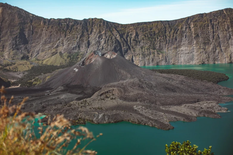 a large body of water with a mountain in the background, by Kogan Gengei, pexels contest winner, sumatraism, crater lake, vulcano, slate, conde nast traveler photo