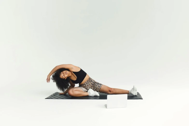 a woman in a leo leo leo leo leo leo leo leo leo leo leo leo leo leo, unsplash, figuration libre, doing splits and stretching, sport bra and shorts, with furniture overturned, imaan hammam