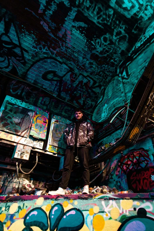 a man riding a skateboard up the side of a ramp, a portrait, unsplash, graffiti, in a cyberpunk themed room, standing in ruins, techwear clothes, cavern