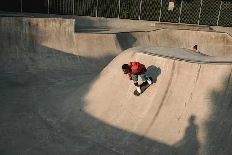 a man riding a skateboard up the side of a ramp, a picture, bowl, parks, carving, shot on iphone 1 3 pro