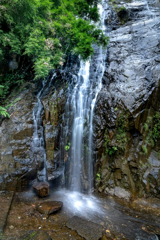 a waterfall in the middle of a lush green forest, hurufiyya, slide show, las pozas, thumbnail, multiple stories
