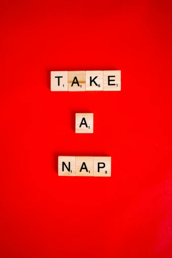a red wall with scrabbles spelling take a nap, an album cover, trending on unsplash, naive art, nootropic stimulant, snapchat photo, snoring, napa