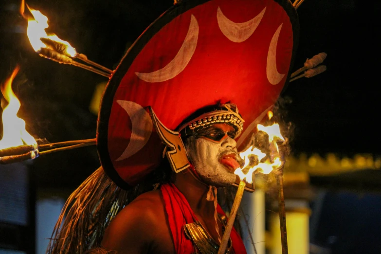 a man that has some kind of fire on his head, pexels contest winner, mayan priestess, square, wielding a spear, sri lanka