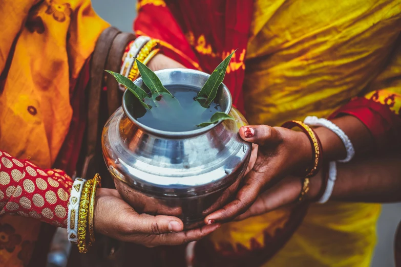 a couple of people that are holding some kind of pot, trending on unsplash, samikshavad, submerged temple ritual scene, avatar image, female, drink