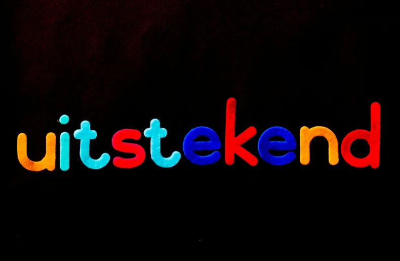 a close up of a colorful text on a black background, inspired by Egbert van Heemskerck, shutterstock contest winner, letterism, kikis delivery service, awestruck, 8k octan advertising photo, nft art