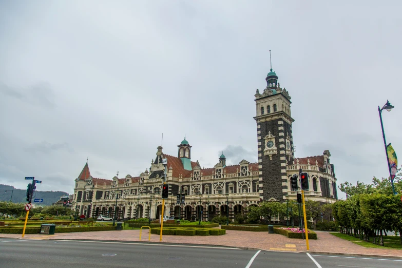 a large building with a clock tower on top of it, new zeeland, monorail station, ornate retreat, uhq