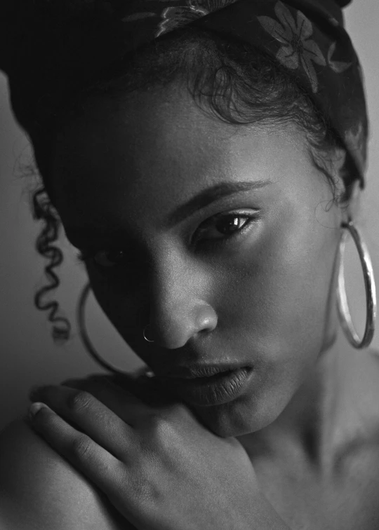 a black and white photo of a woman, by Lily Delissa Joseph, nose ring, ashteroth, photo from a promo shoot, peaceful mood