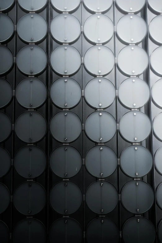 a group of barrels stacked on top of each other, inspired by Andreas Gursky, unsplash, bauhaus, in gunmetal grey, metal panels, transistors, medium closeup