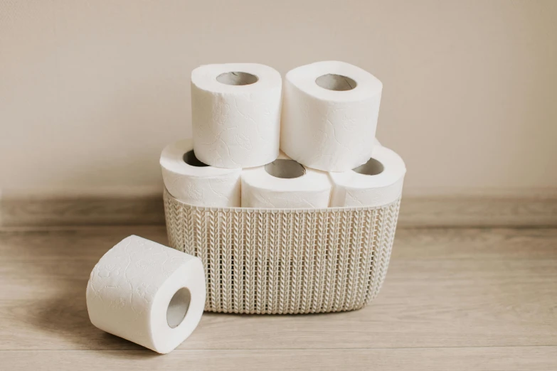 a basket filled with four rolls of toilet paper, inspired by Sarah Lucas, pexels contest winner, plasticien, organic ceramic white, 6 pack, rectangle, handcrafted