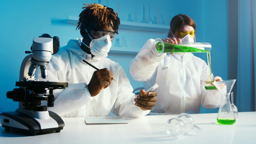 a couple of people that are in a lab, trending on pexels, 4 2 0, polychromatic, biopunk suit, getty images