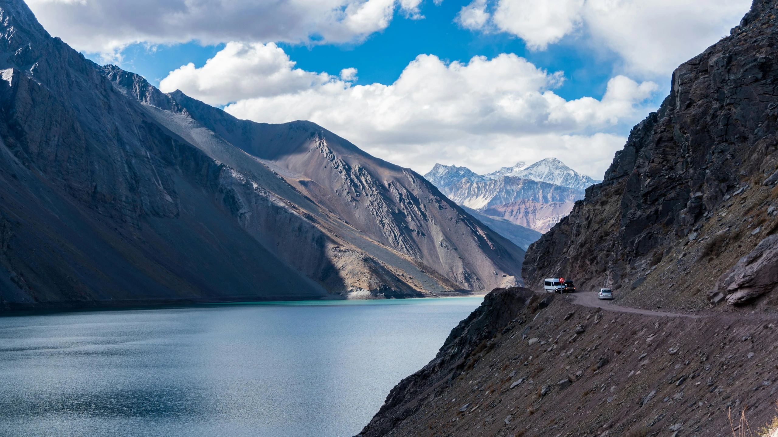 a large body of water surrounded by mountains, by Julia Pishtar, pexels contest winner, hurufiyya, andes, road trip, avatar image