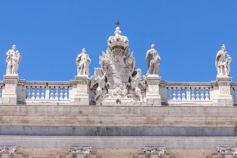 a group of statues on top of a building, a marble sculpture, inspired by Juan Giménez, neoclassicism, symmetrical crown, profile image