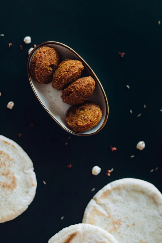 a spoon full of food sitting on top of a table, by Julia Pishtar, dau-al-set, crispy buns, humus, banner, shot with sony alpha