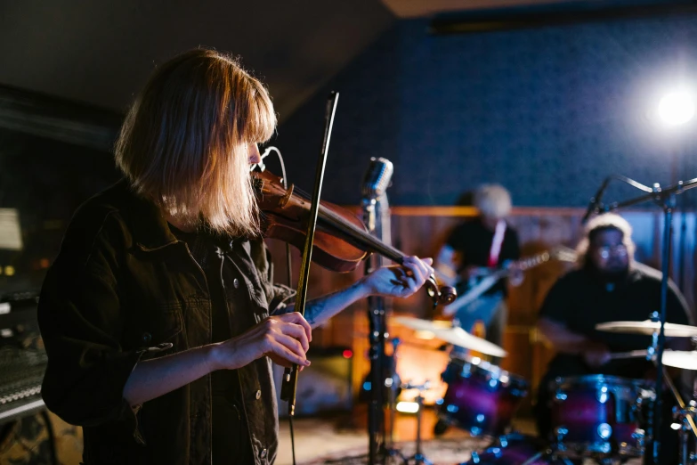 a woman playing a violin in a music studio, by Nick Fudge, unsplash, saturday night in a saloon, avatar image, band, lachlan bailey