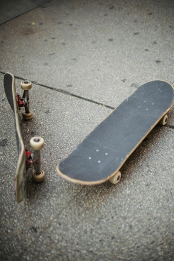 a skateboard laying on the ground next to another skateboard, by Dan Christensen, 1 2 9 7, tangible, kreuzberg, 2 0 5 6