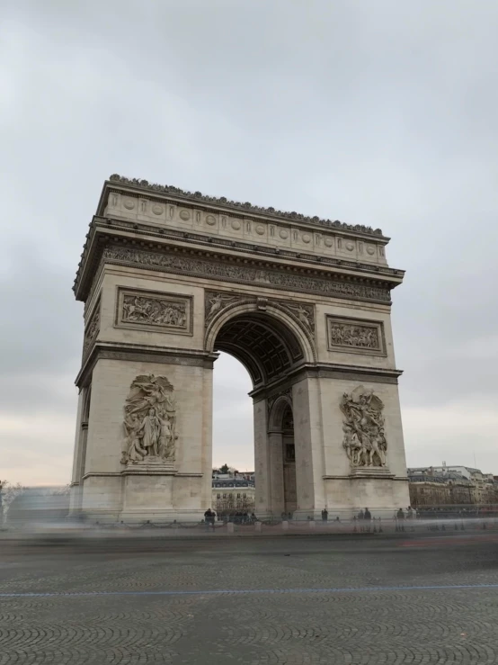 a very tall arch sitting on the side of a road, a marble sculpture, pexels contest winner, neoclassicism, very smoky paris bar, slide show, overview, low quality photo