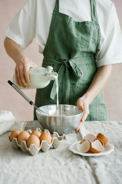 a woman in an apron mixing eggs in a bowl, by Lucette Barker, trending on pexels, renaissance, made of glazed, lulu chen, tall, linen