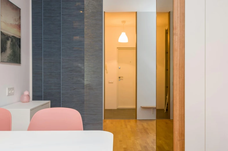 a dining room with a white table and pink chairs, inspired by Albert Paris Gütersloh, unsplash, light and space, doors to various bedrooms, close-up shot taken from behind, grey, neo kyiv