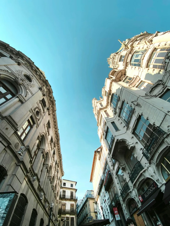 a couple of buildings that are next to each other, a picture, unsplash contest winner, baroque, low angle fisheye view, profile image, fallout style istanbul, italian renaissance architecture