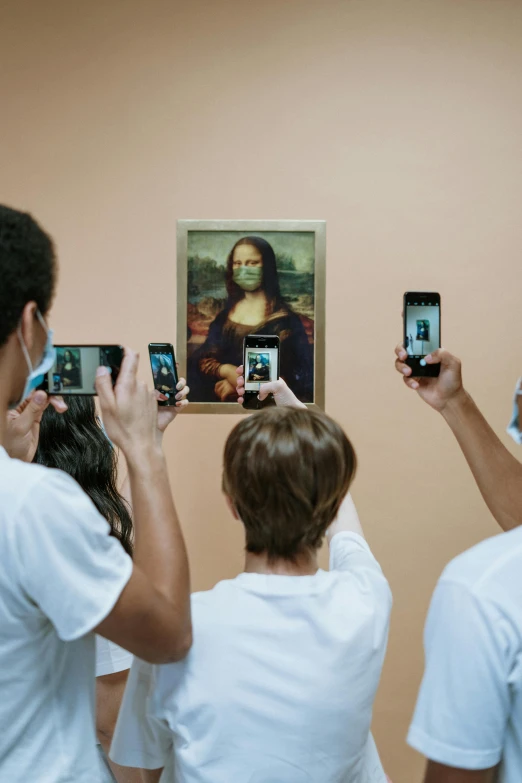 a group of people taking pictures of a painting, by Julia Pishtar, trending on unsplash, a portrait of an android, monalisa, 2 0 1 0 s, francis goya