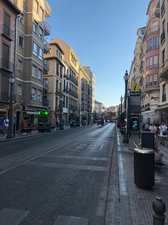 a city street filled with lots of tall buildings, a picture, spanish alleyway, profile image, nice lighting, clean streets