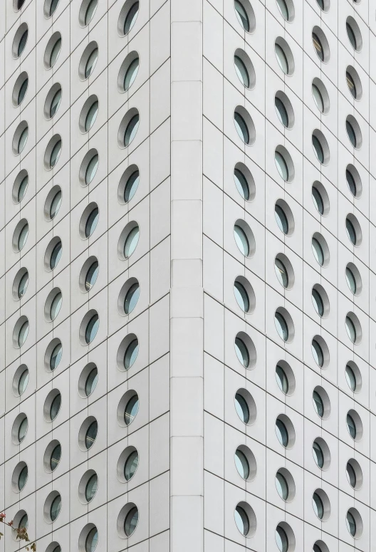 a tall white building with lots of windows, pexels contest winner, portholes, subtle patterns, square face, curved